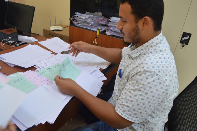 AMIDEAST/Yemen Internship Program  An intern doing some filing work.
